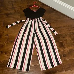 This is a cute lightly used high-waisted jumpsuit!